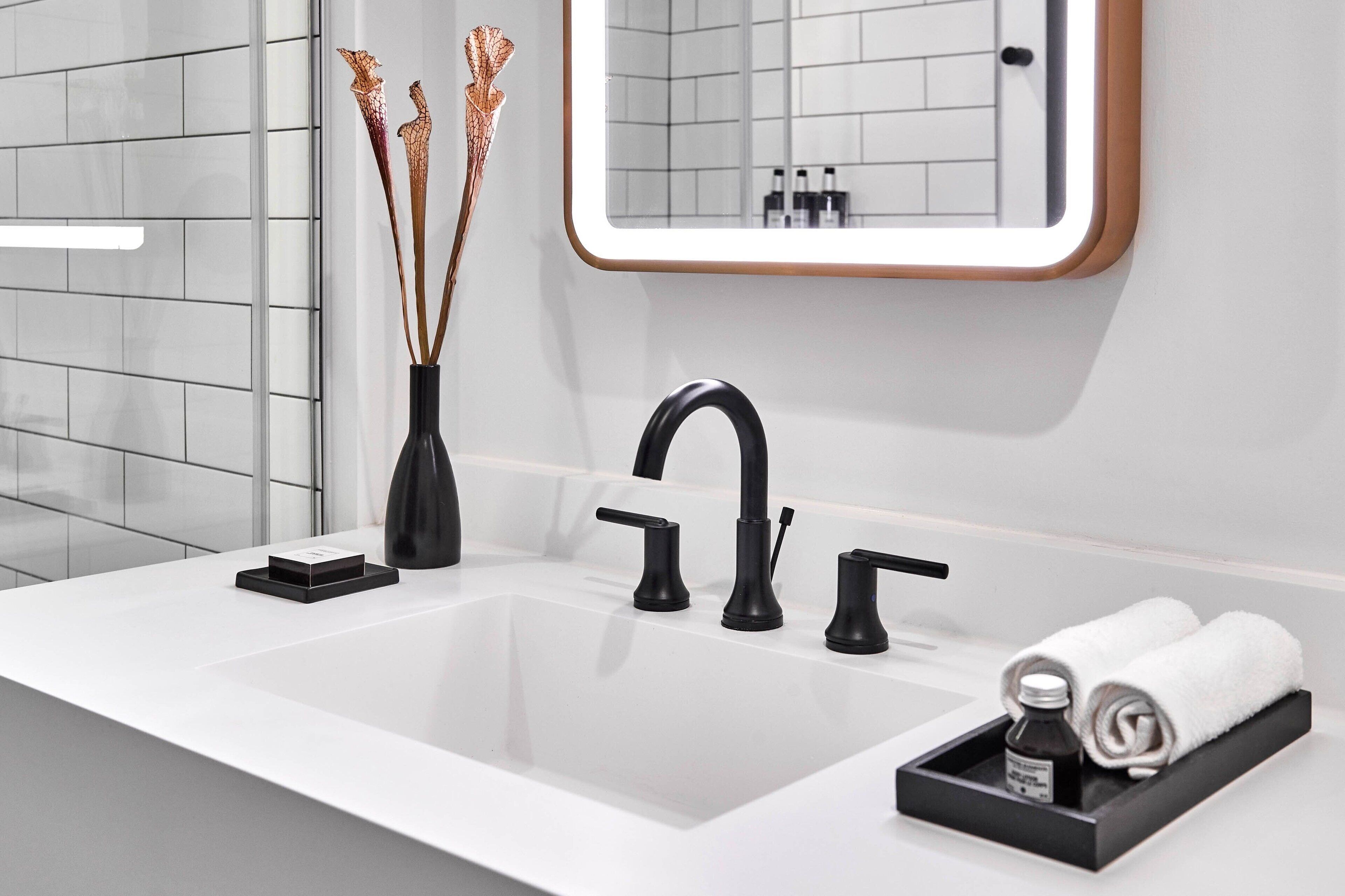 combined shower/bathtub, designer toiletries, hair dryer, towels