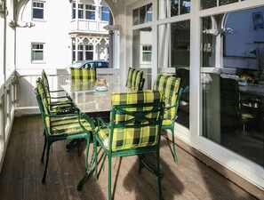 Enjoy dining al fresco on the deck with a round table and six comfortable chairs.