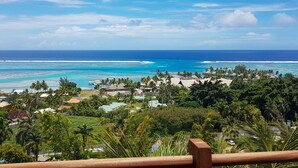 A coastal resort with ocean views, palm trees, and a clear sky. - Villa Tea by Tahiti Homes (Moorea-Maiao)