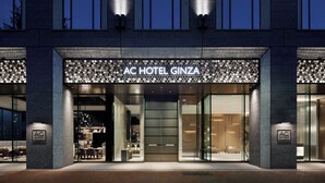 The exterior of AC Hotel Ginza with a modern facade, large glass windows, and a prominent entrance. - AC Hotel by Marriott Tokyo Ginza (Tokyo)