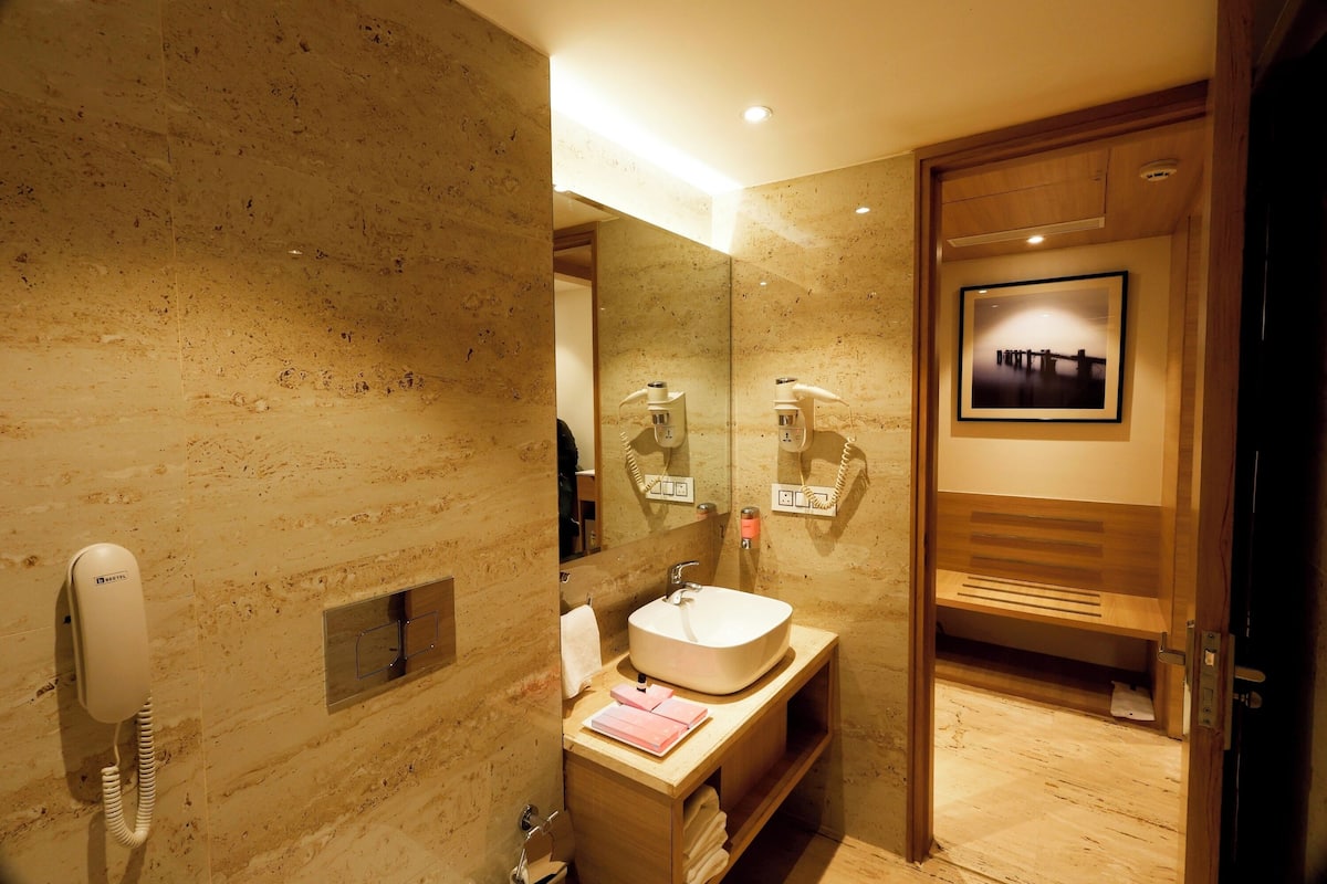 luxury suite | bathroom | shower, free toiletries, hair dryer, slippers