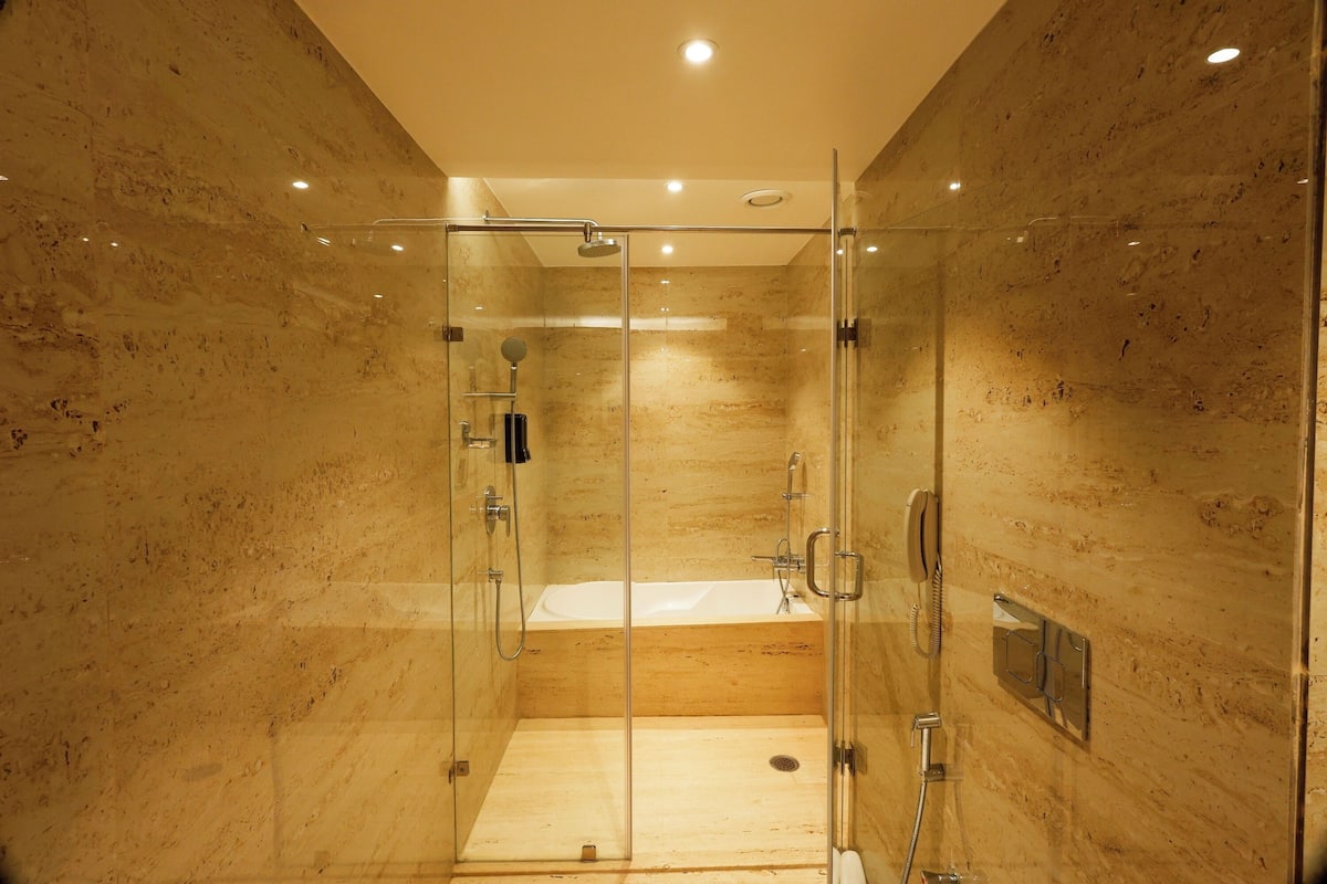 luxury suite | bathroom | shower, free toiletries, hair dryer, slippers