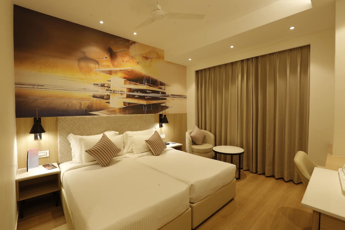 deluxe twin room | in-room safe, individually furnished, desk, laptop workspace