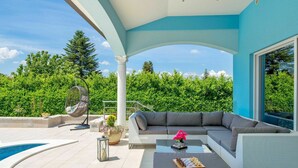 A modern outdoor living area with a pool, a large sofa, and a chessboard. - Wonderful private villa for 8 people with private pool, WIFI, A/C, TV and patio (Pazin)