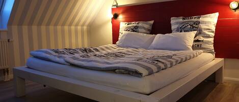 2 dormitorios, tabla de planchar con plancha, cuna de viaje y wifi