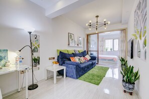 Family Double or Twin Room | Living area | TV