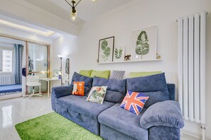 Family Double or Twin Room | Living room | TV