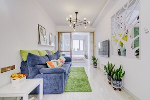 Family Double or Twin Room | Living area | TV