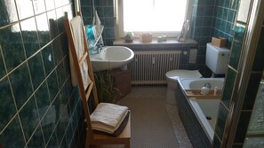 Bathtub, hair dryer, towels, soap