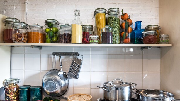 A kitchen with various jars of food, a stove, and cooking utensils. - Meeuwen Manor - A treasure near Amsterdam (Edam)
