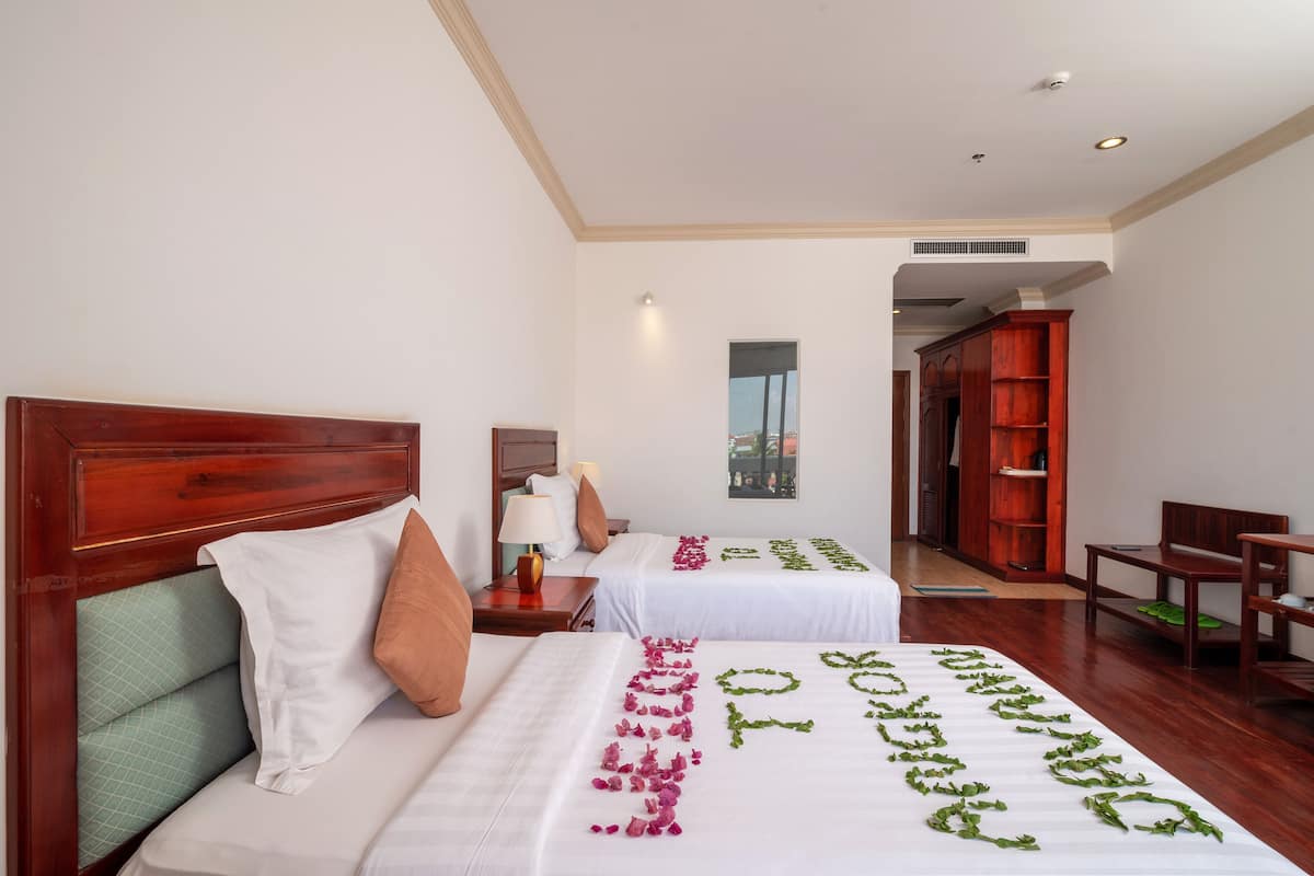 Family Twin Room | Minibar, in-room safe, desk, laptop workspace