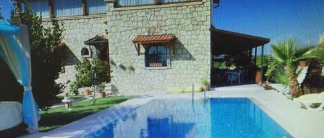 Seasonal outdoor pool, pool umbrellas, pool loungers