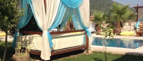 Seasonal outdoor pool, pool umbrellas, pool loungers