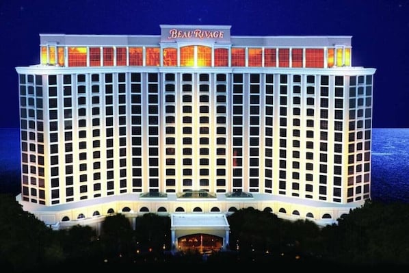 A large, multi-story hotel with a prominent marquee sign at the top.