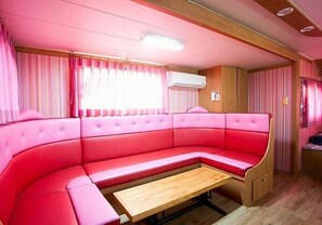 Caravan Care | Living area | Flat-screen TV - Caravan Eco Village (Hongseong)