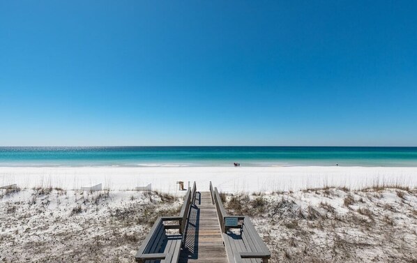 Walk along the pristine beach to the turquoise waters.