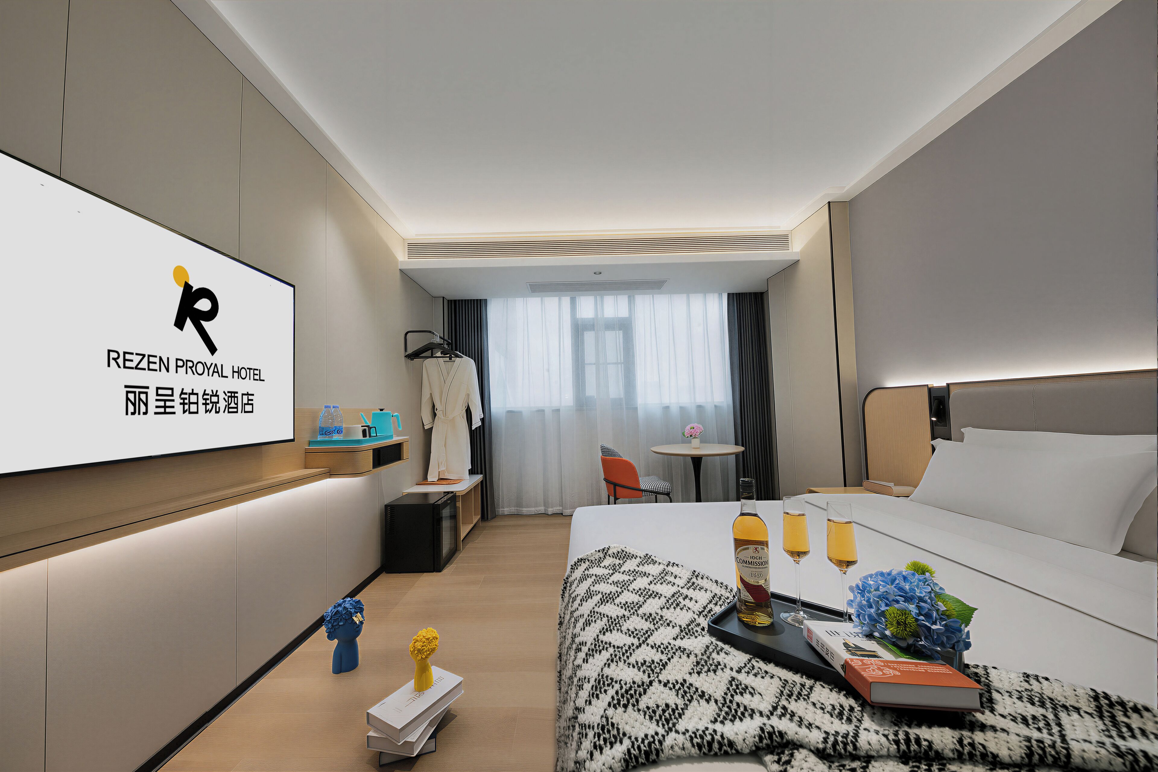 A hotel room with a bed, bedside table, TV, and a view of the outside.