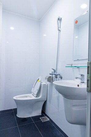 Shower, rainfall showerhead, hair dryer, towels