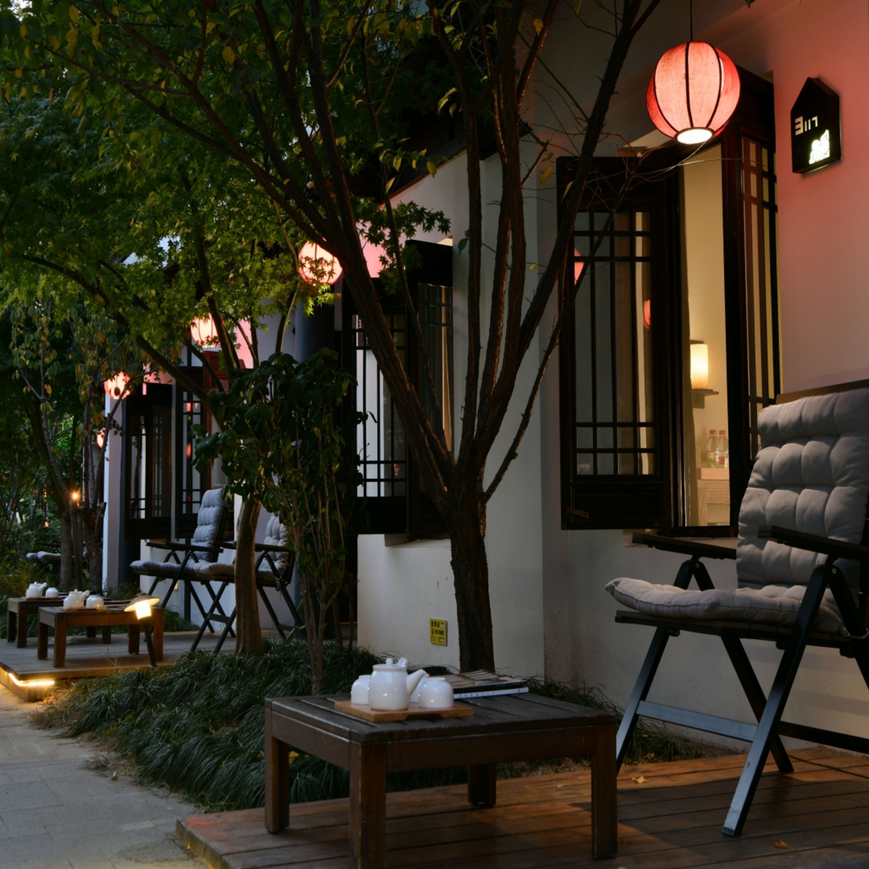 A traditional-style building with wooden furniture and a table set for tea.