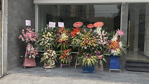 A flower shop with various bouquets displayed outside. - Paragon House & Residence (Hanoi)