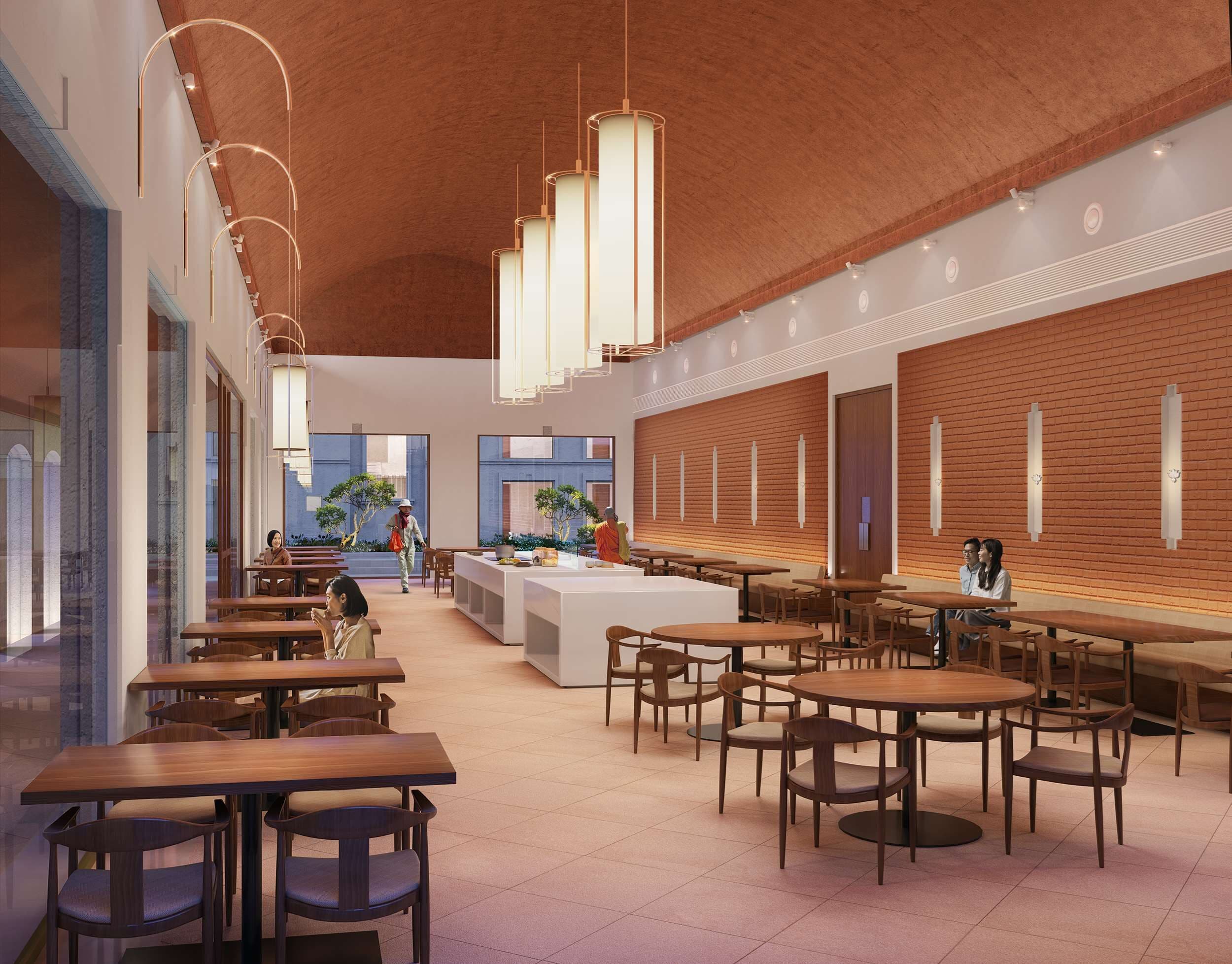 A modern restaurant with wooden tables and chairs, a central island with a bar, and pendant lighting.
