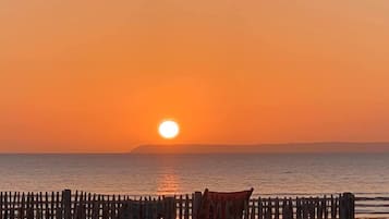On the beach, sun-loungers