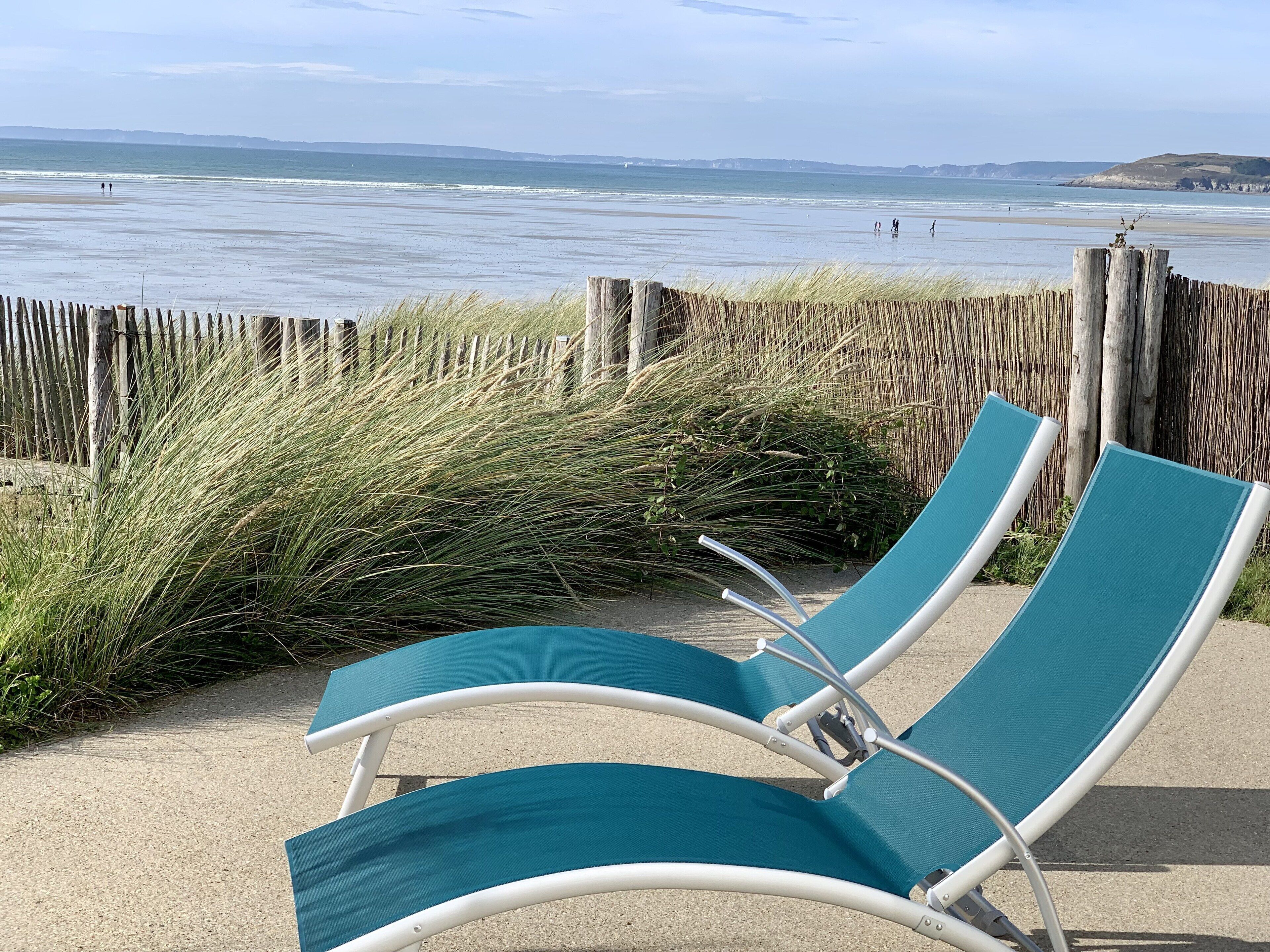 On the beach, sun-loungers