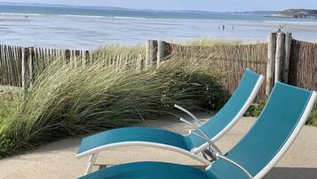 On the beach, sun-loungers
