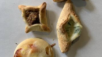 Four pastries on a white surface.
