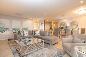 Family Penthouse, 4 Bedrooms | Living area | 52-inch Smart TV with digital channels, TV, video game console - Knightsbridge Rentals (Ballito)