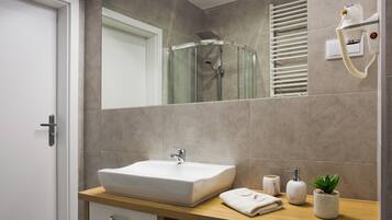 Shower, hair dryer, towels, soap