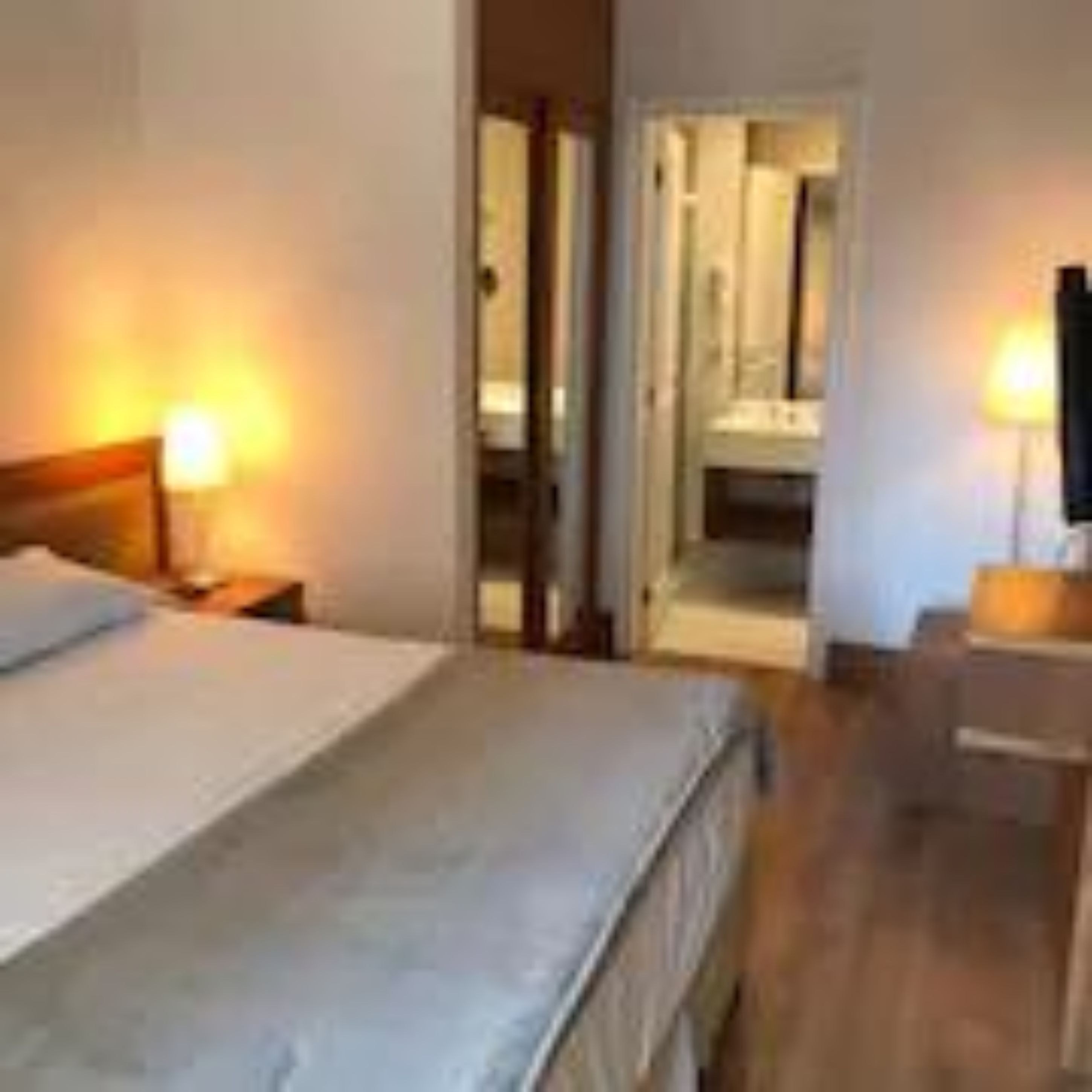 classic suite | in-room safe, desk, laptop workspace, blackout curtains