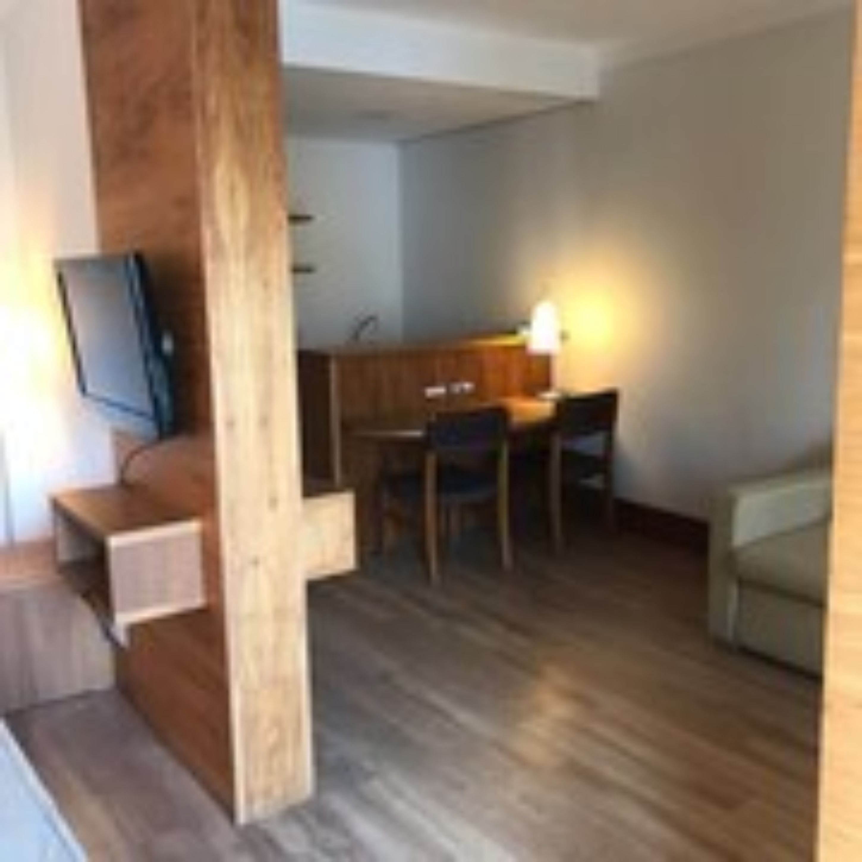 classic suite | in-room safe, desk, laptop workspace, blackout curtains