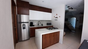 Fridge, microwave, stovetop, coffee/tea maker