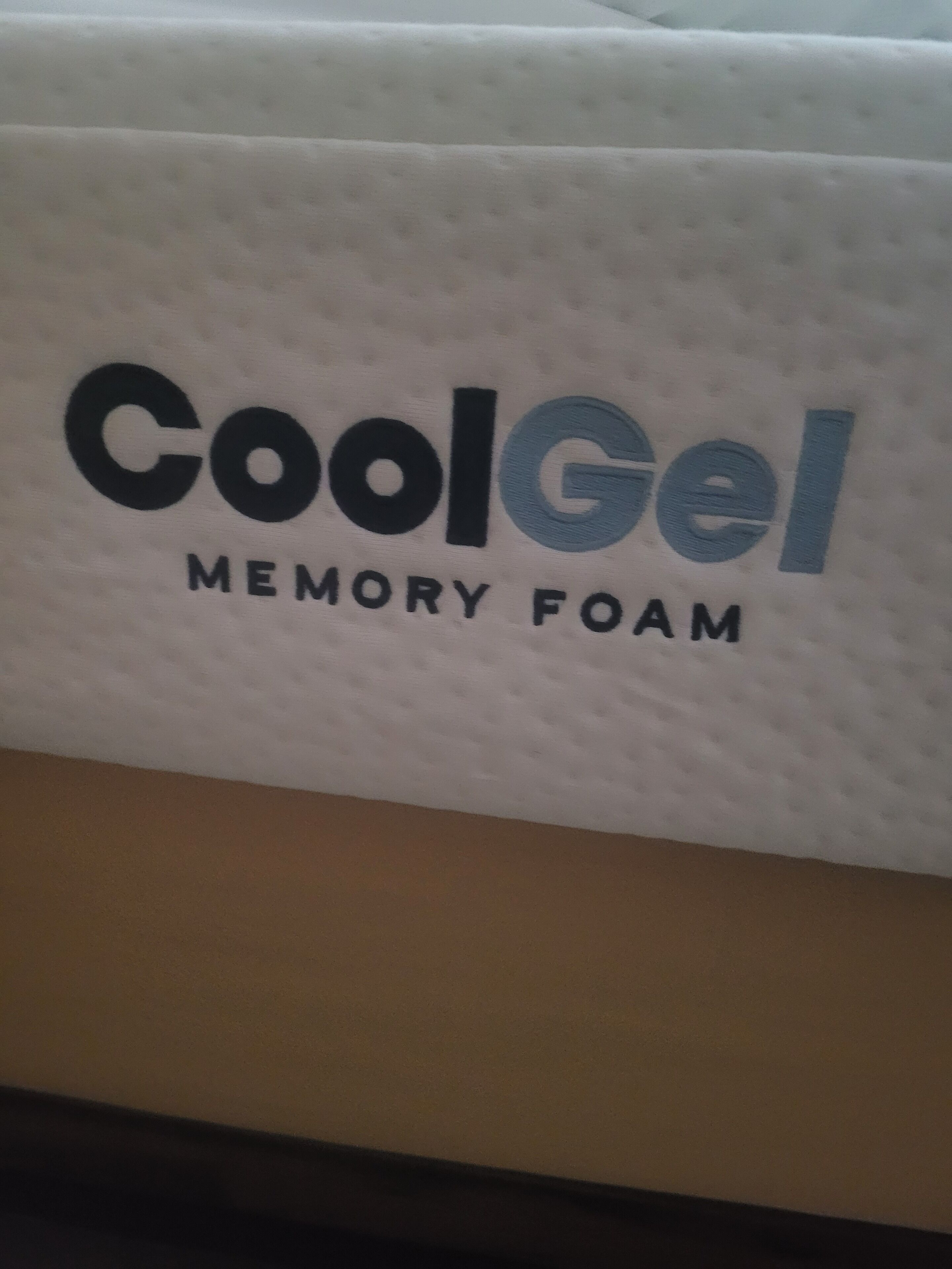 A white pillow with 'CoolGel Memory Foam' text.