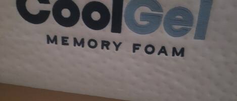 A white pillow with 'CoolGel Memory Foam' text.