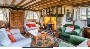 Cottage | Living area | 30-inch TV with digital channels, fireplace