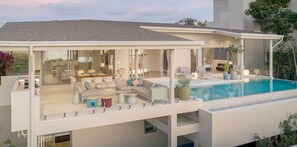 A modern house with a pool, outdoor seating, and a covered patio area. - Samui Sunsets Luxury Villas (Koh Samui)
