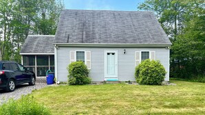 A single-story house with a grey roof, white siding, and a front porch. - Perfect Family Escape! Walk to everything and relax. It’s all here for you  (York)