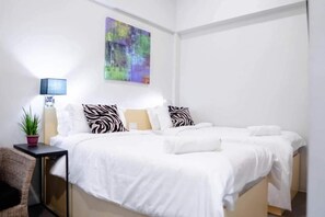 In-room safe, laptop workspace, blackout curtains, iron/ironing board - Radlett Residences (Tuguegarao)