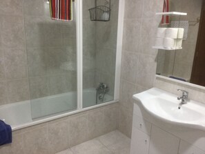 Hair dryer, towels, shampoo, toilet paper