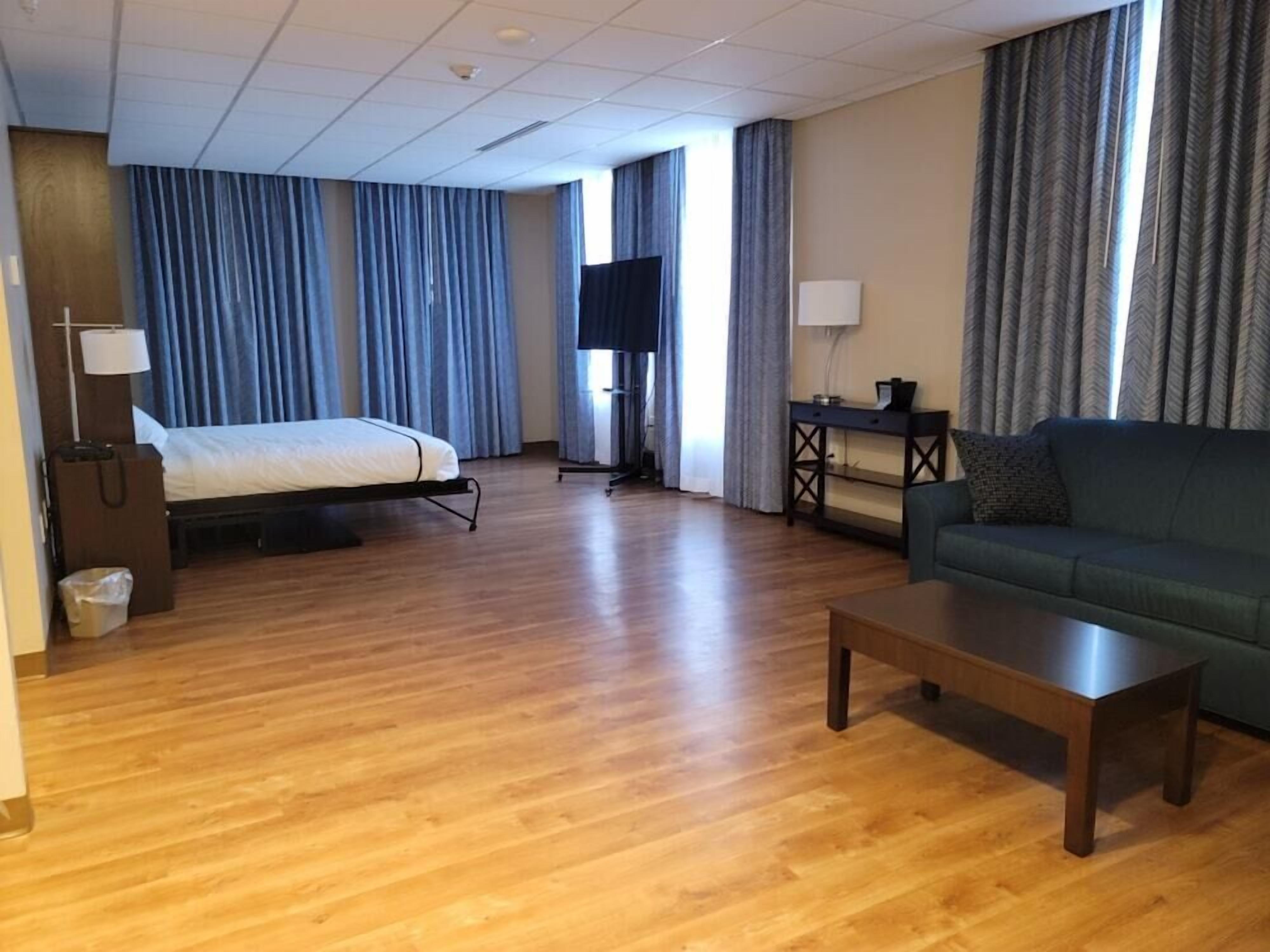 Premium bedding, down comforters, pillowtop beds, in-room safe