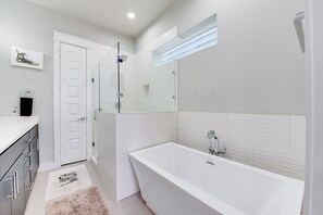 Combined shower/tub, hair dryer, towels, soap
