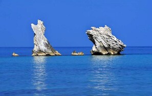On the beach, sun-loungers