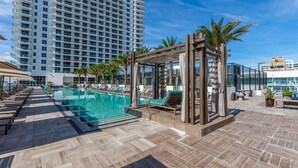 A rooftop pool area with lounge chairs and a pergola. - HYDE HOUSE NEW (Hollywood)