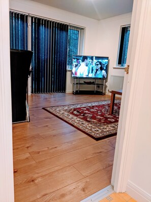 Apartment | Living room | 30-inch TV with cable channels