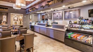 A restaurant with a counter, menu boards, and a refrigerated display. - 1BD/Orlando - Near Disney - Private Kitchen and Living Area! (Lake Buena Vista)