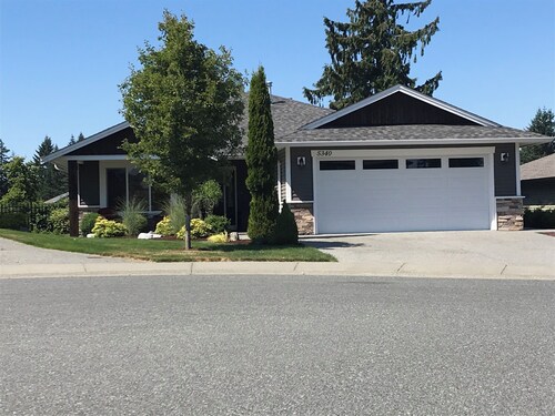 Lower Level Entry Home with private Patio & back yard.
