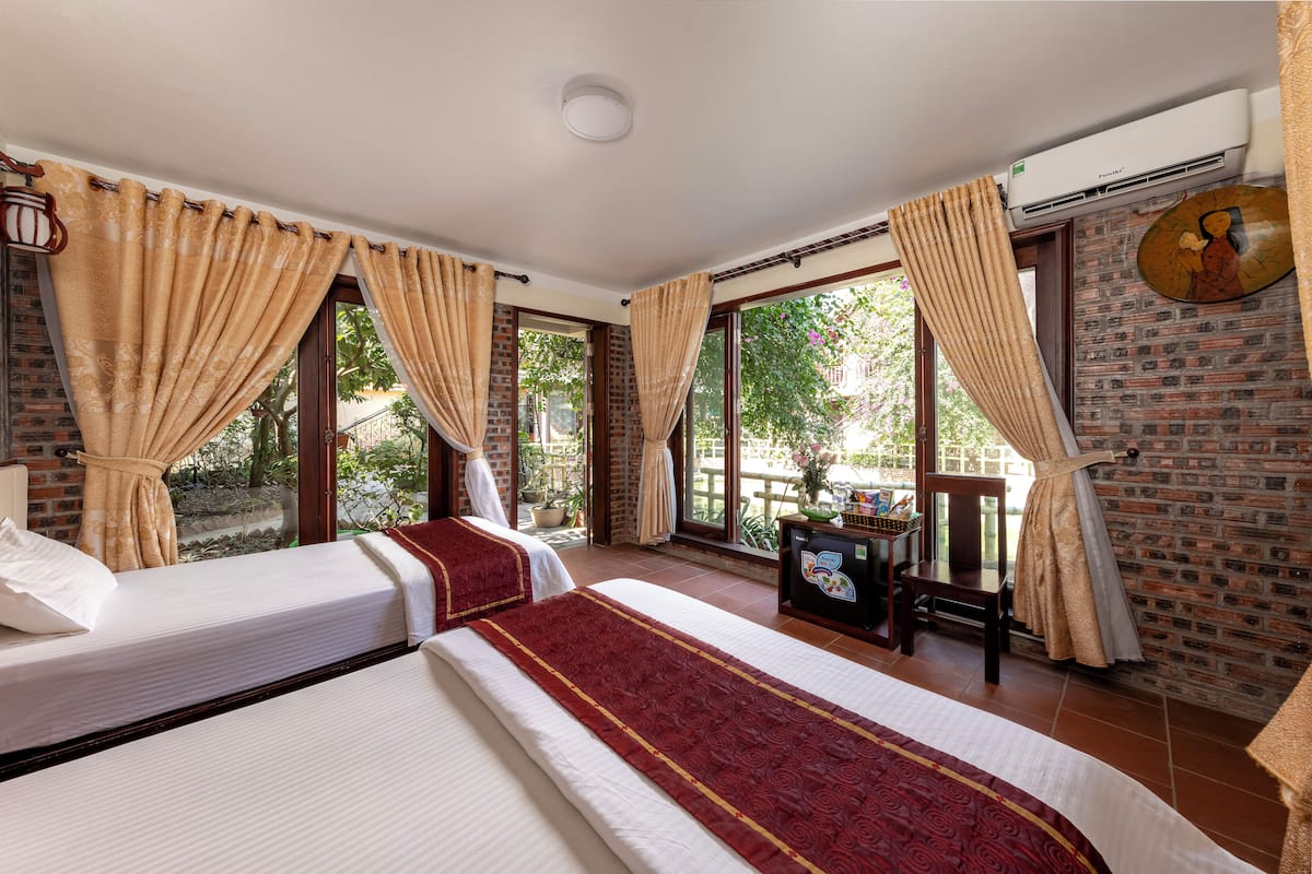 Deluxe Room, 2 Double Beds, Garden View | Desk, laptop workspace, blackout drapes, soundproofing