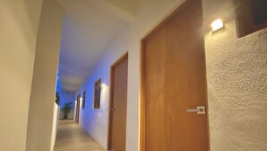 A hallway with wooden doors and a wooden floor. - Brand new departments, just five minutes' walk from the Marina Dock. (Cabo San Lucas)